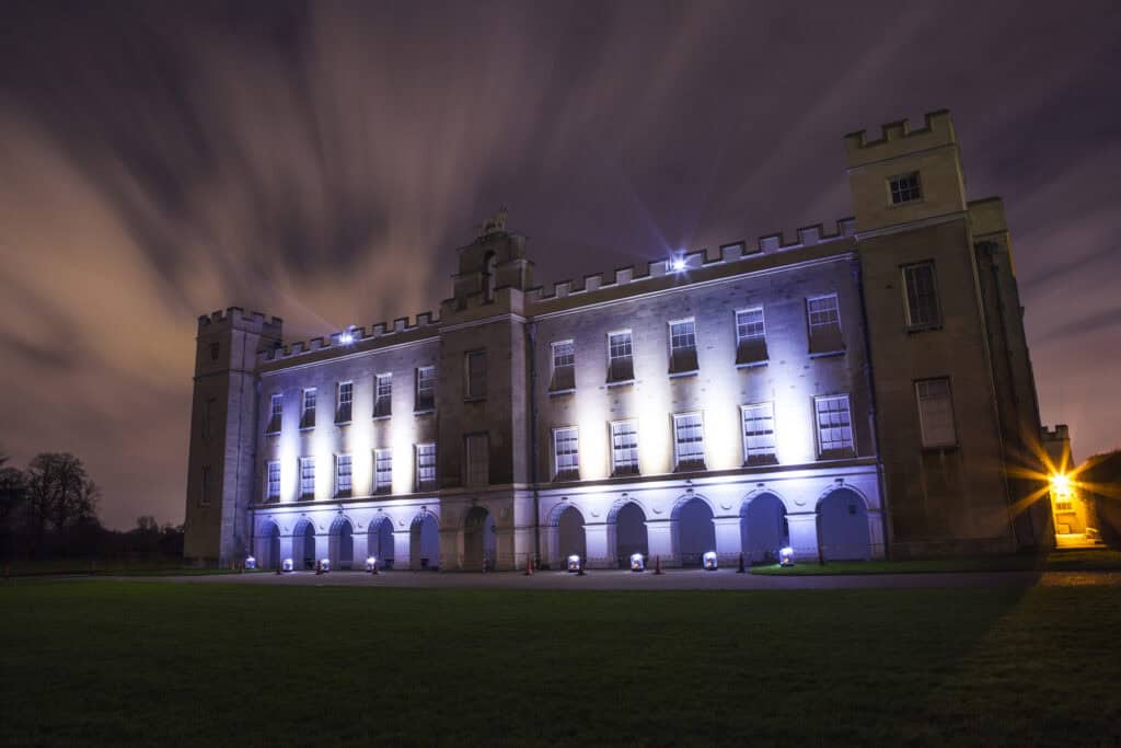 Illuminated front side of the Syon House at nighttime