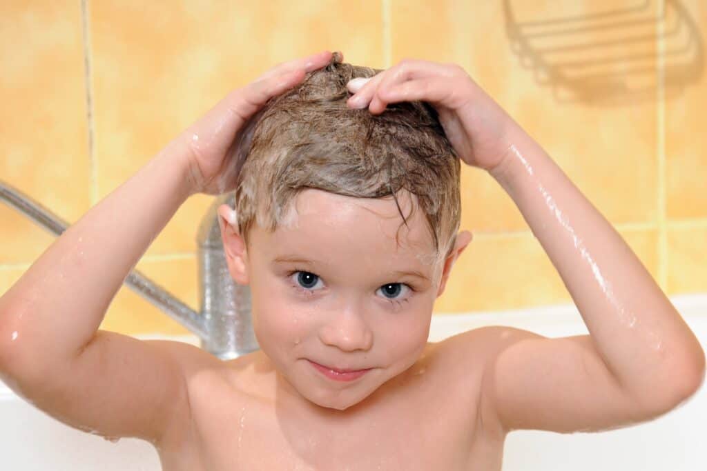A young boy in the shower