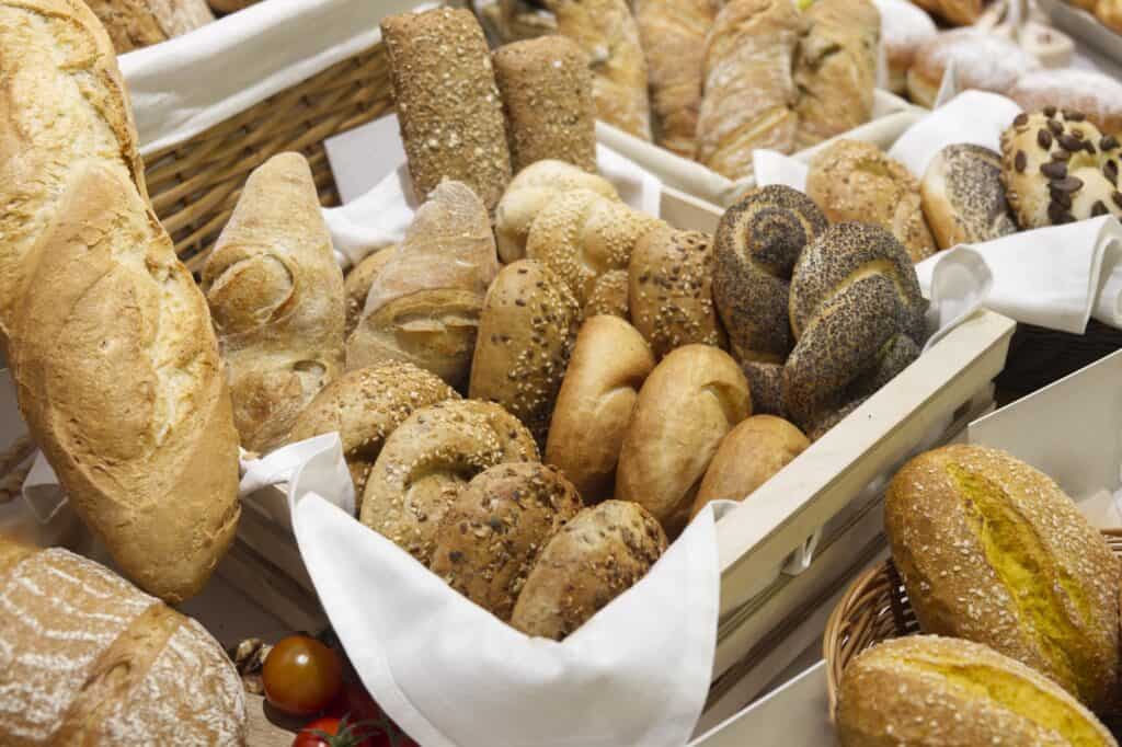 A basket of artisan breads in a market